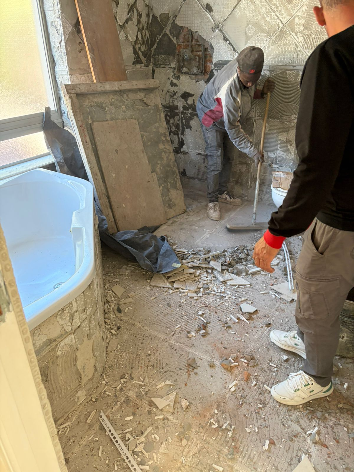 Bathroom shower area during demolition