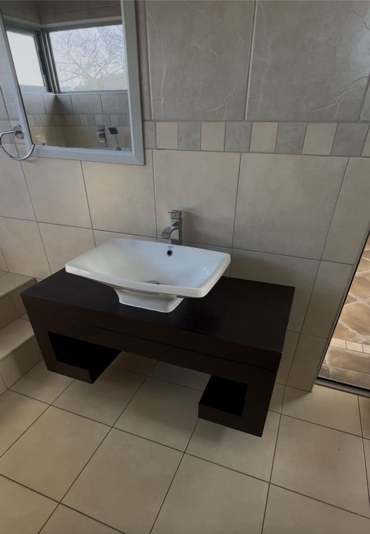 Single bathroom vanity before renovation with video overlay removed