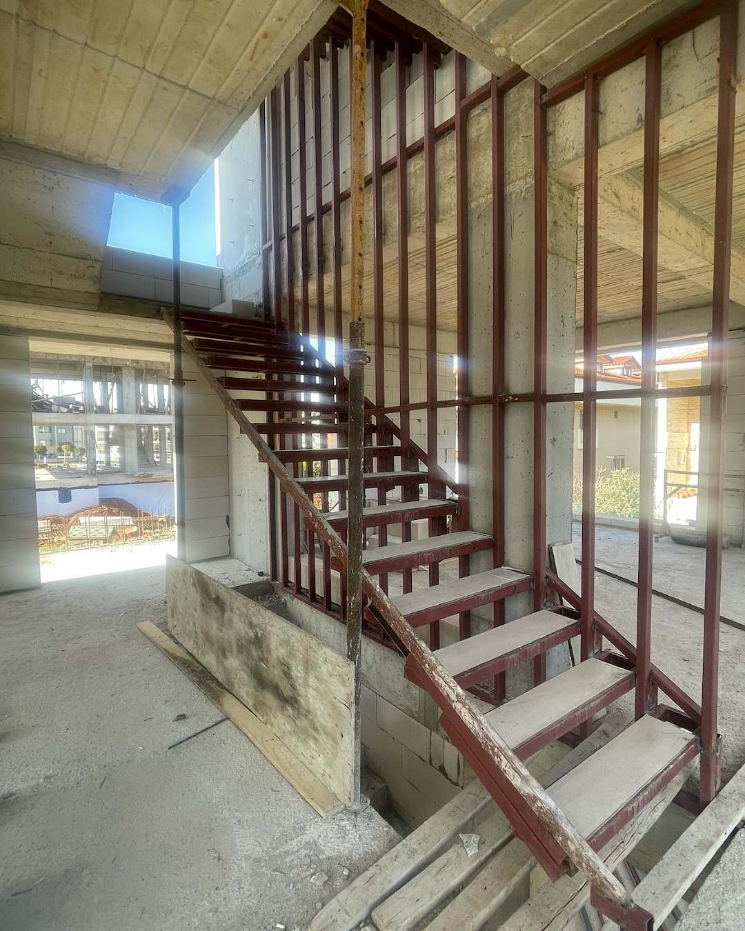 Steel stair structure inside a concrete building under construction